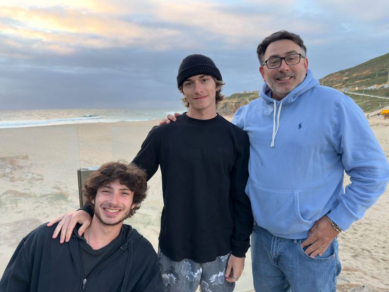 Artie and two of his sons on the beach at dusk