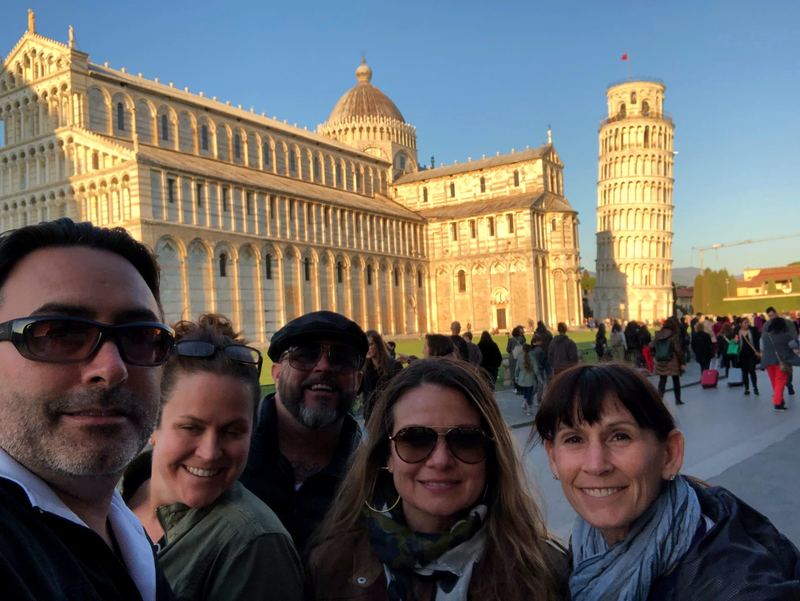 Artie, April, and friends in front of the Leaning Tower of Pisa