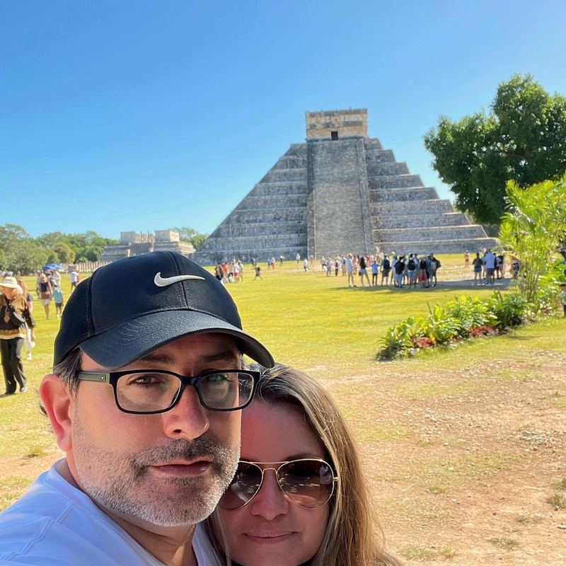 Artie and April in front of a Mayan pyramid