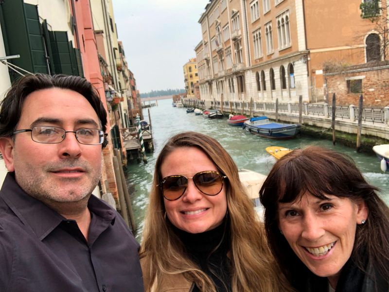 Artie, April, and a friend beside a canal in Venice